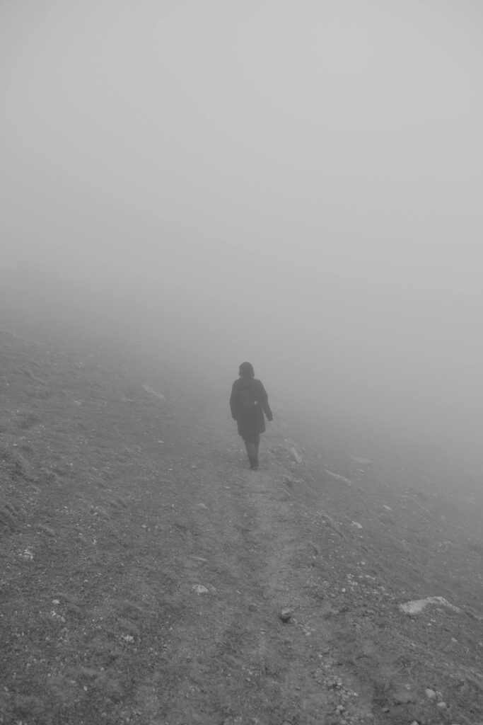 Person walking alone along a quiet path