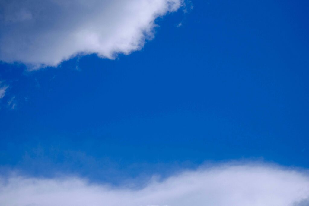 Clouds drifting across an open sky