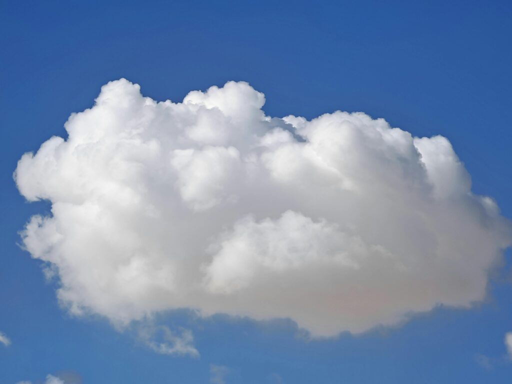 Clouds floating in the sky representing the unknown nature of the afterlife