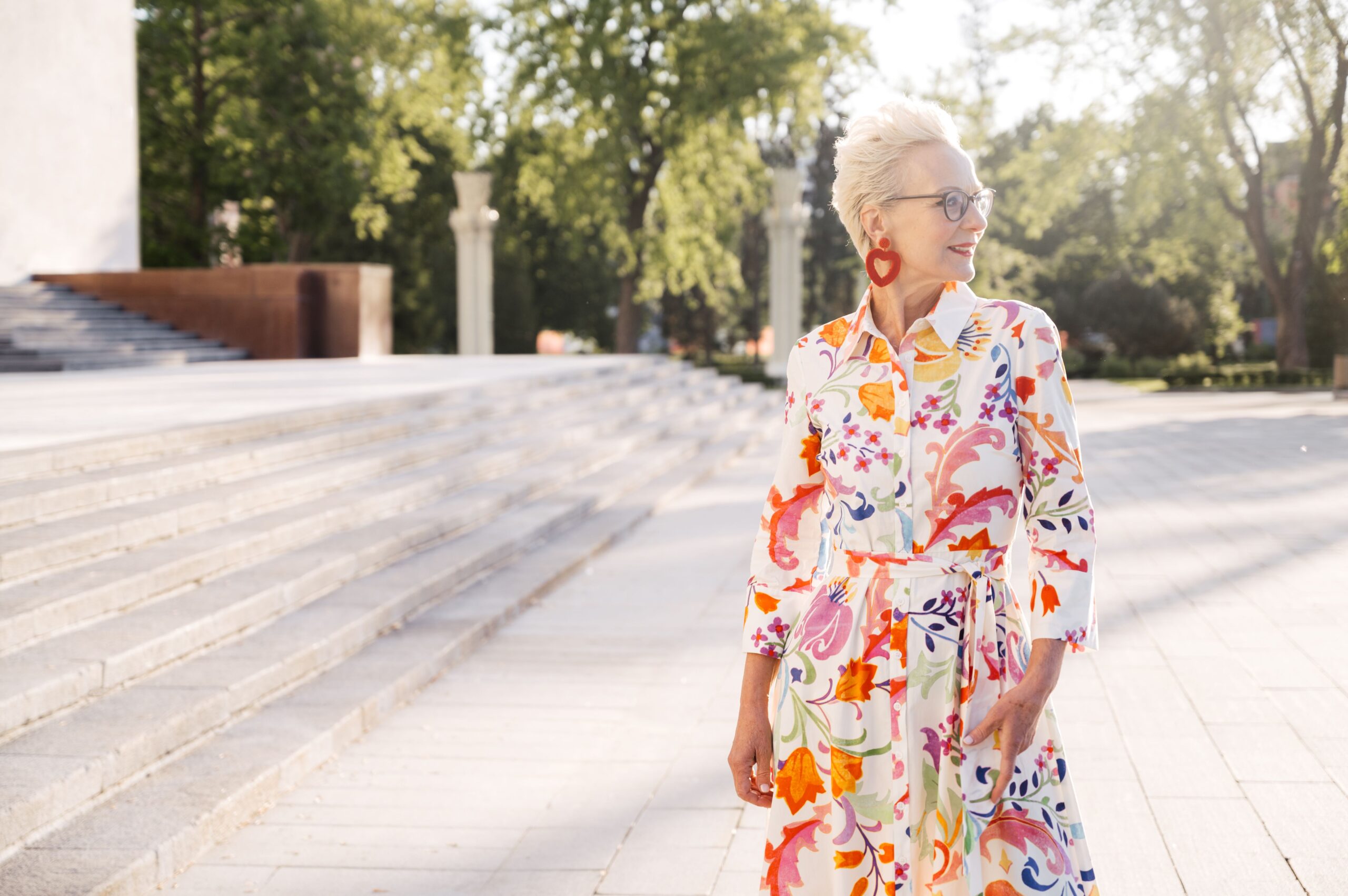Elegant woman enjoying a peaceful afternoon surrounded by warmth, flowers, and timeless melodies.