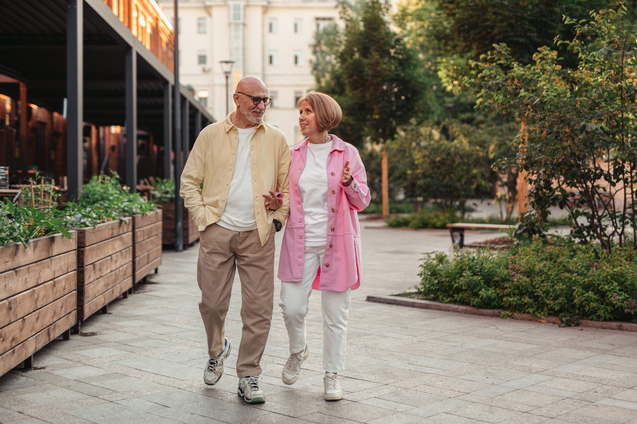 A cheerful couple enjoying a relaxed walk, capturing the warmth, optimism, and timeless charm of everyday Americana.
