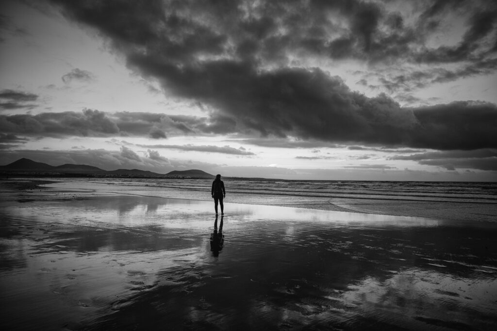 Person standing quietly in contemplation