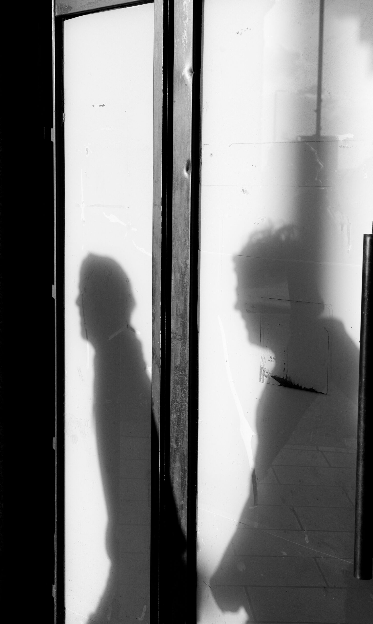 Two distant silhouettes, symbolizing the unexplained connection between karma and rebirth