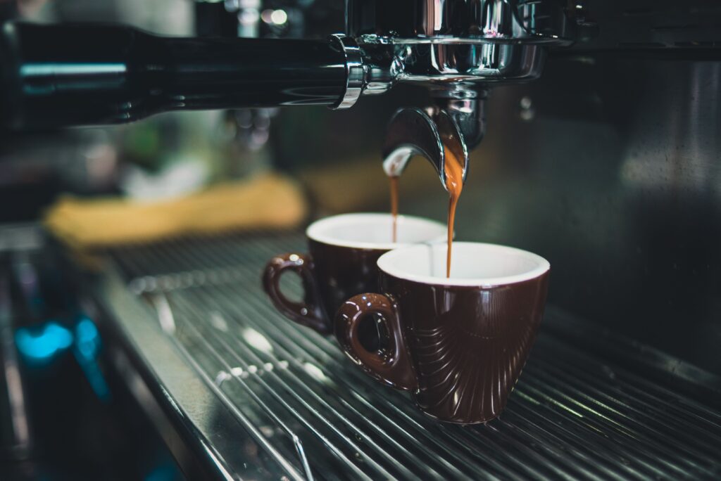 Barista preparing multiple espresso shots