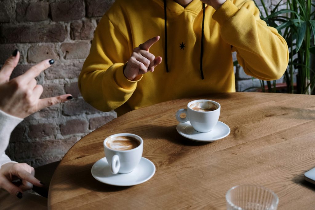 A comparison of black coffee and a sweetened coffee drink with whipped cream